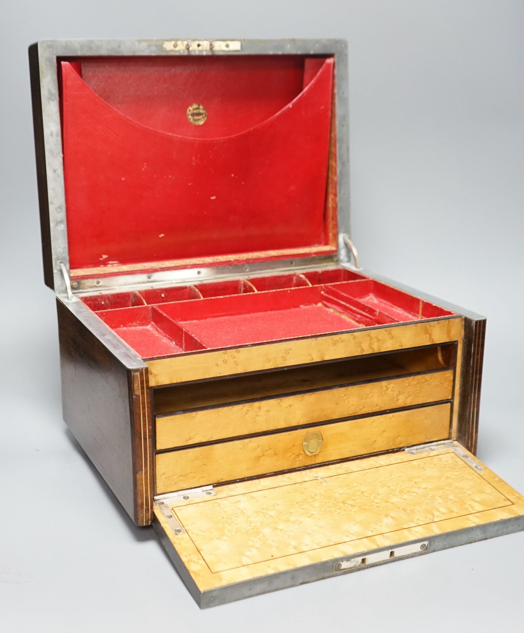 A Victorian rosewood stationery box, with red Morocco interior, by S Woodfield, 21 high x 35cms wide